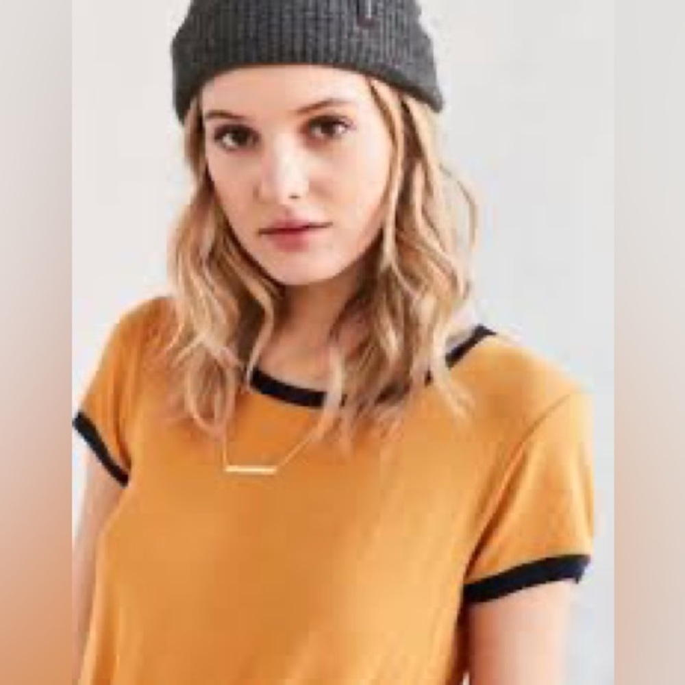 Urban Outfitters. Mustard yellow tee with blue sleeve and neck line. Size XS